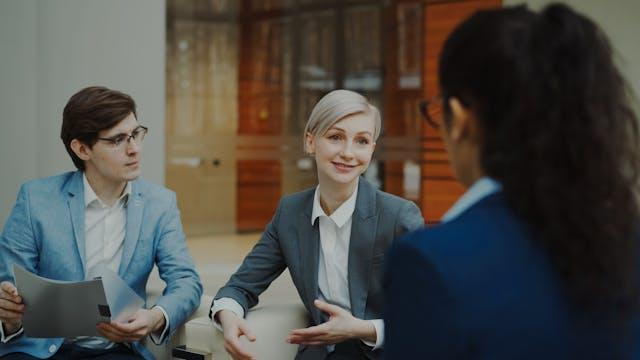 Two people talking to a landlord